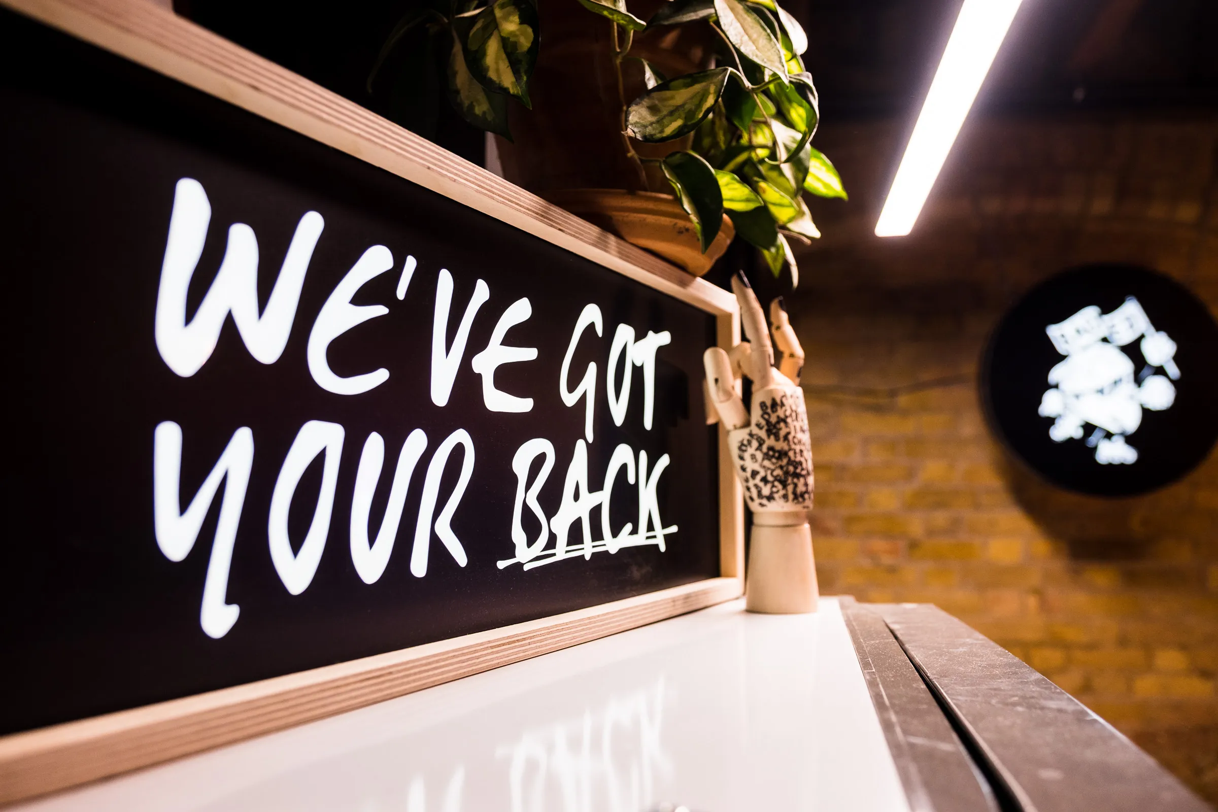 Backed VC - "We've Got Your Back" office signage detail