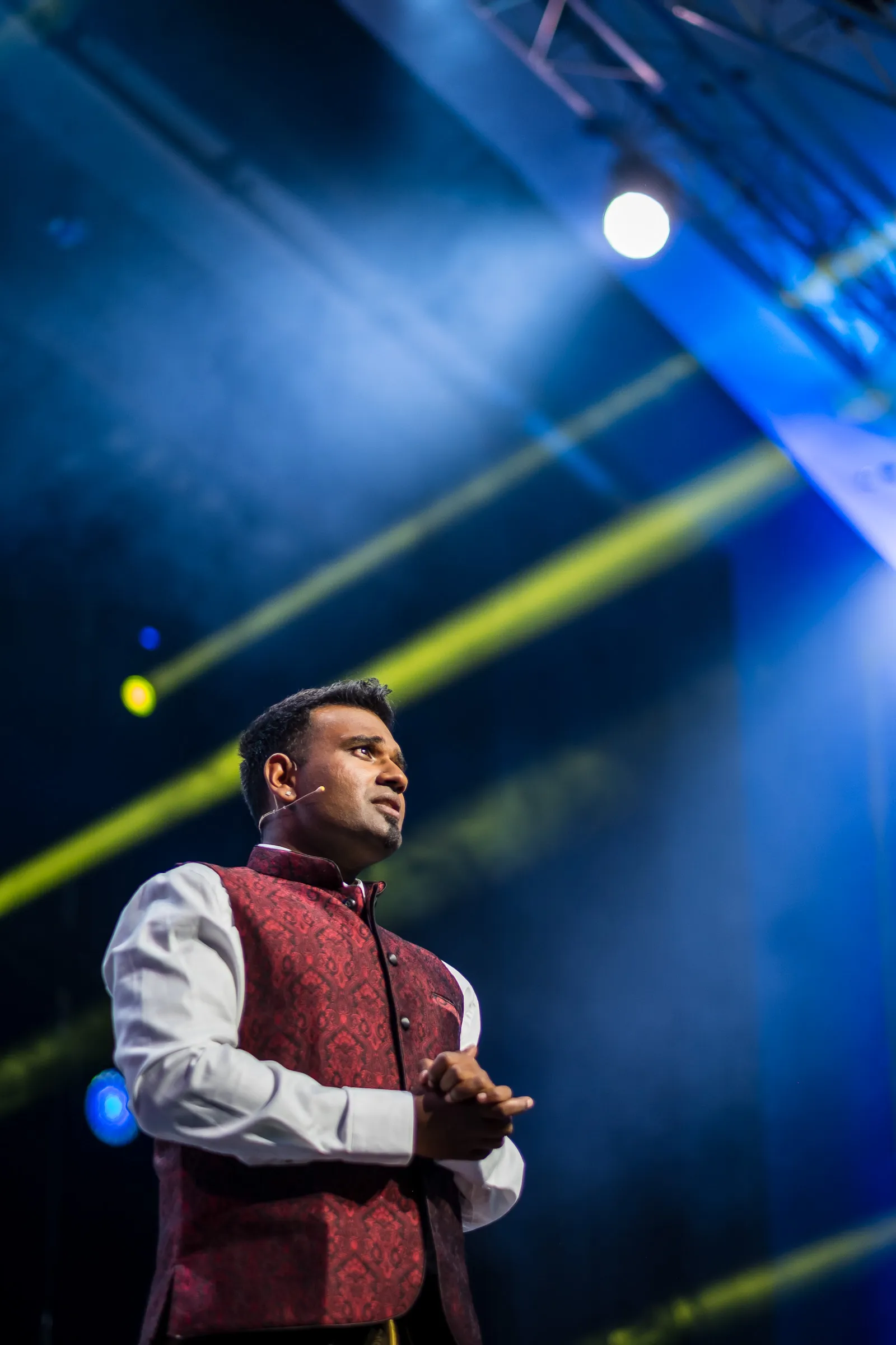 Bits & Pretzels 2019 - Festival host portrait, stage rigging visible overhead