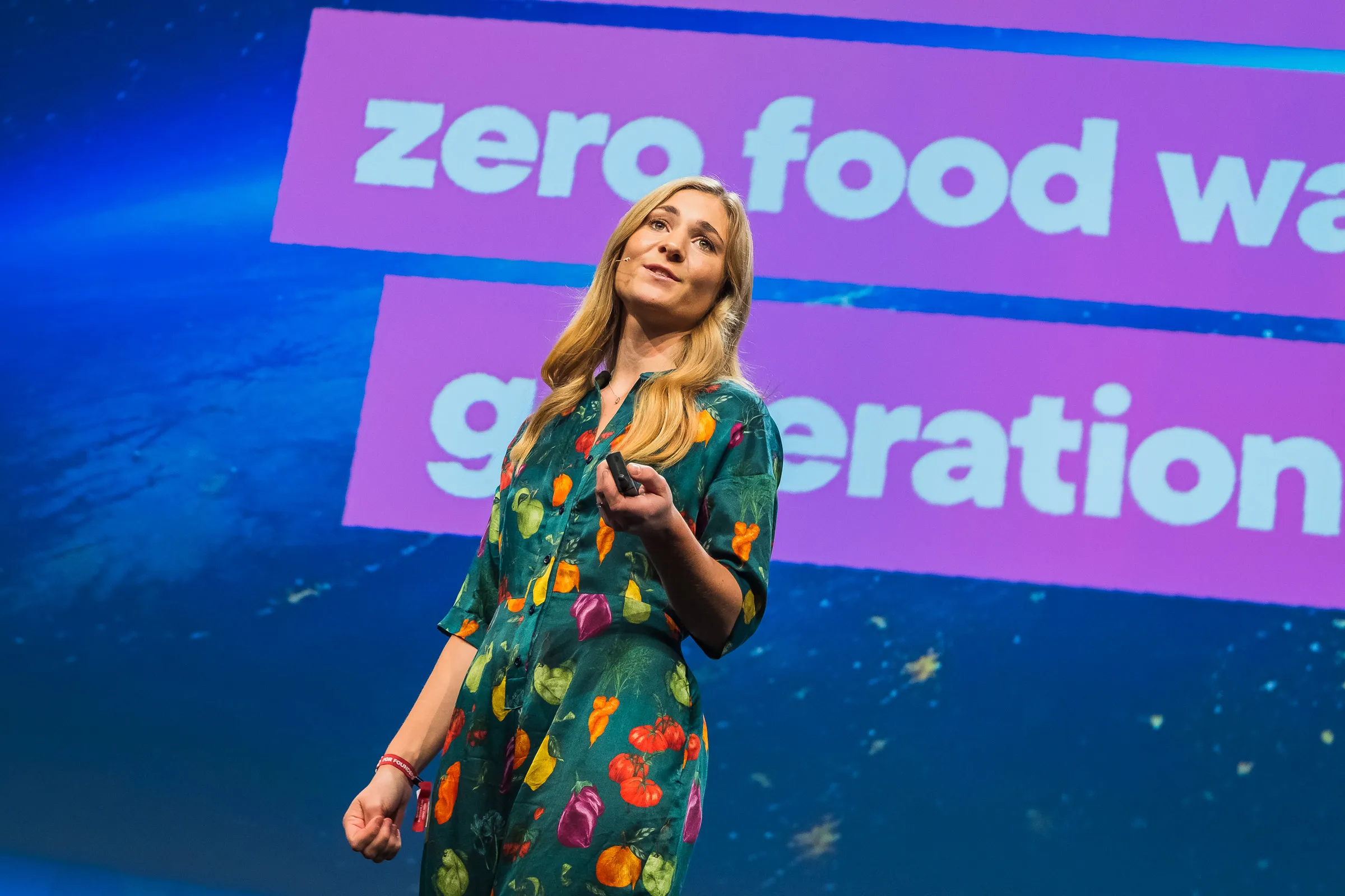 Bits & Pretzels 2019 - Speaker addressing zero food waste, projected backdrop