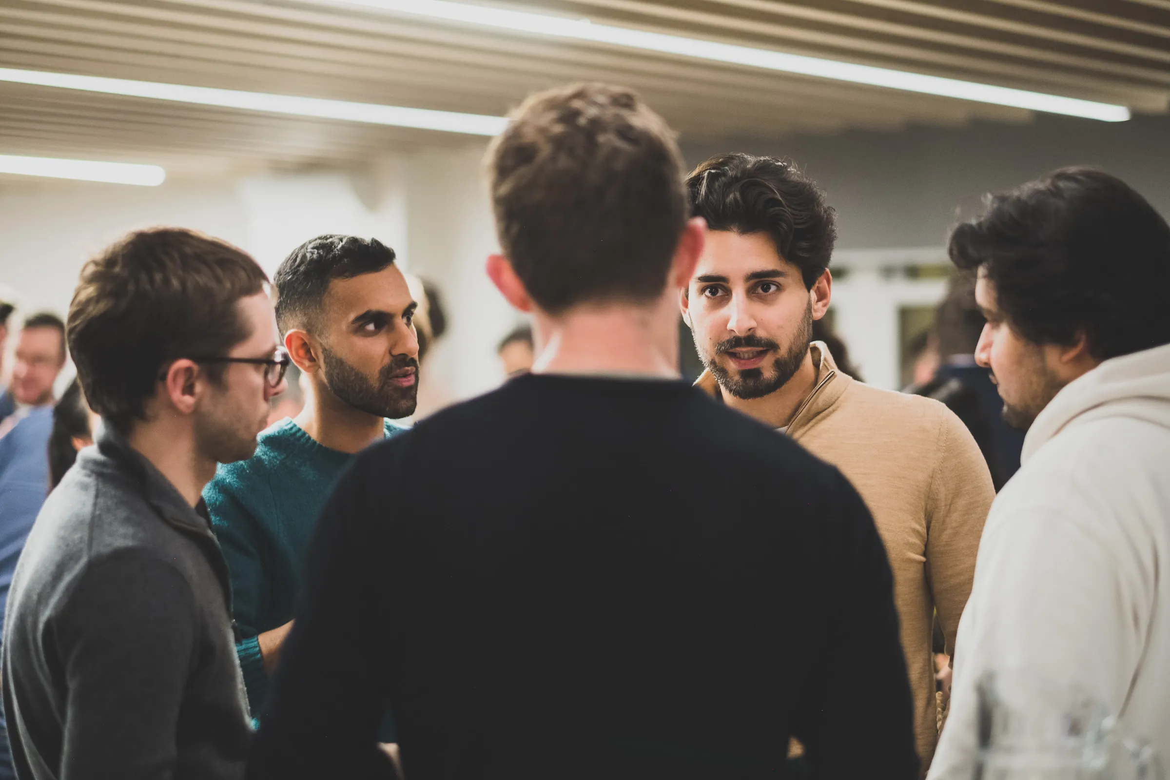 FOV Ventures First Birthday Party - Group of guests deep in discussion