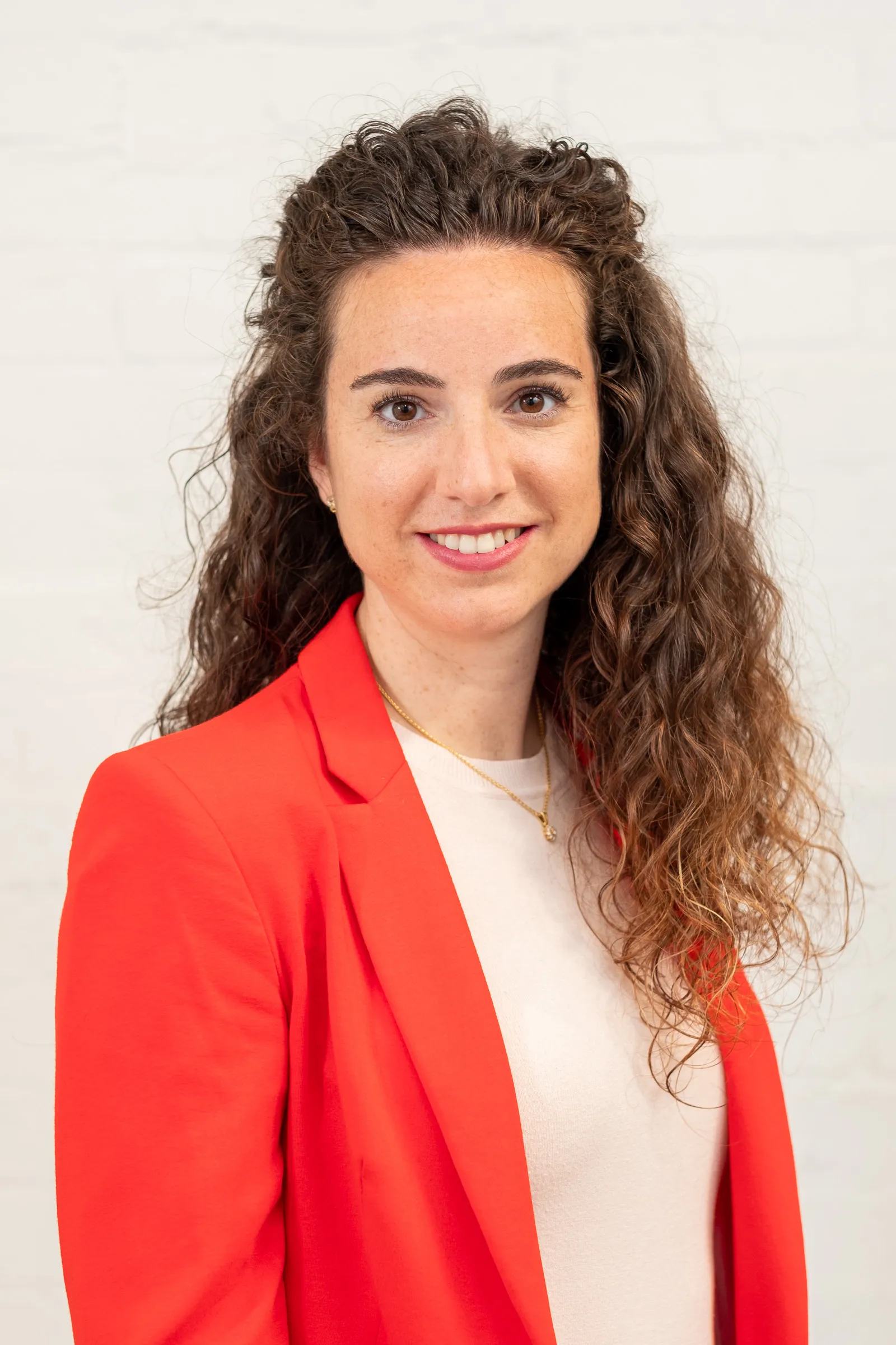 Infarm London Team Photography - Studio headshot, white backdrop, red blazer