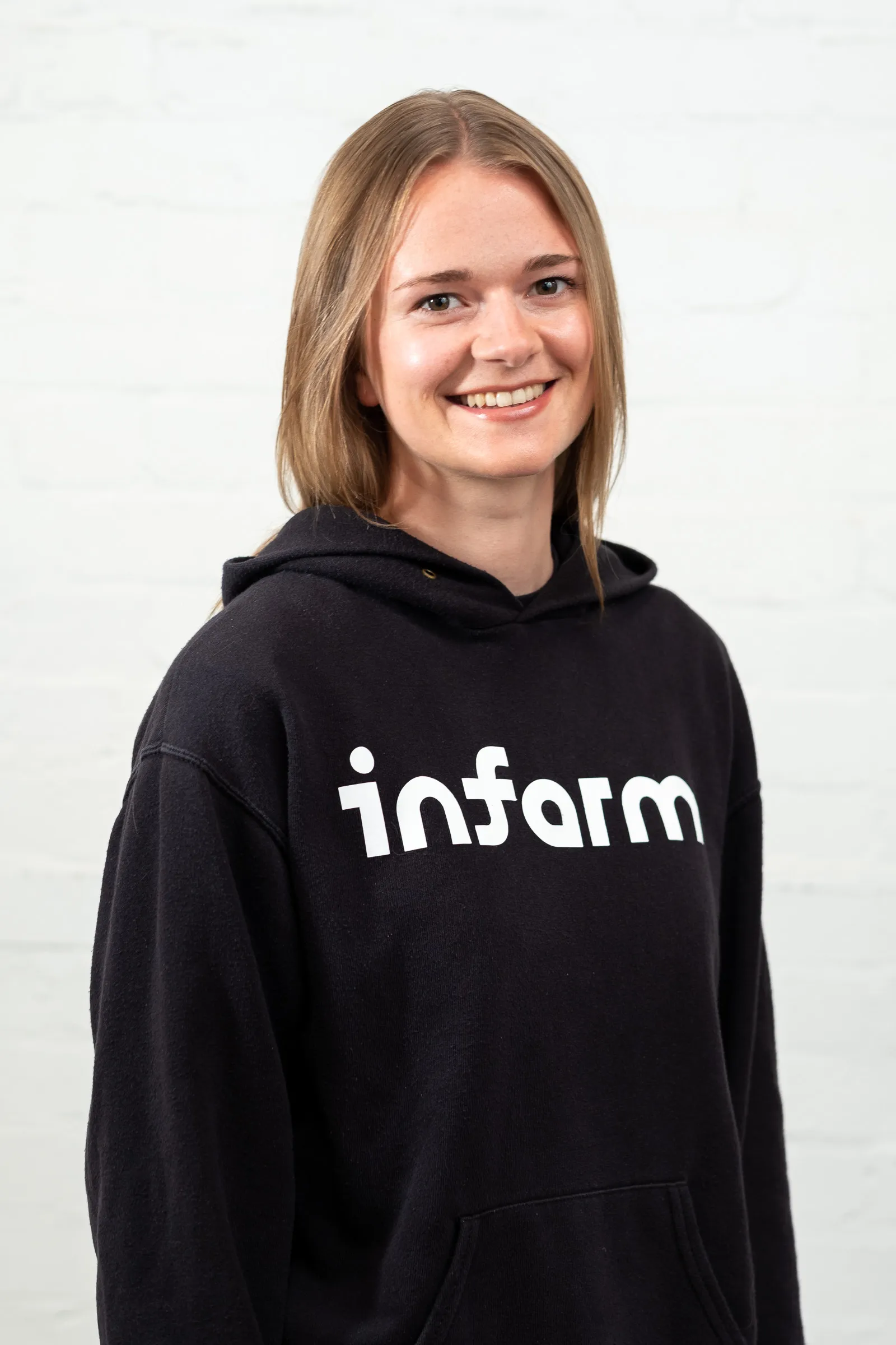 Infarm London Team Photography - Studio headshot, branded Infarm hoodie