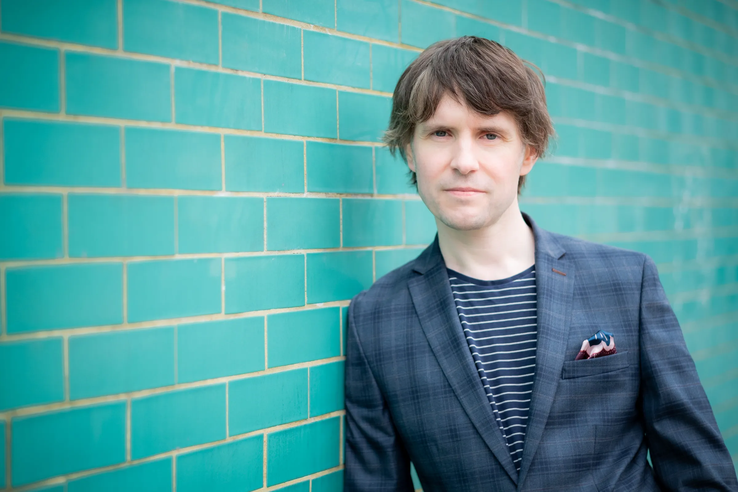 Martin Bryant Personal Branding Headshots - Three-quarter portrait, teal tiled wall