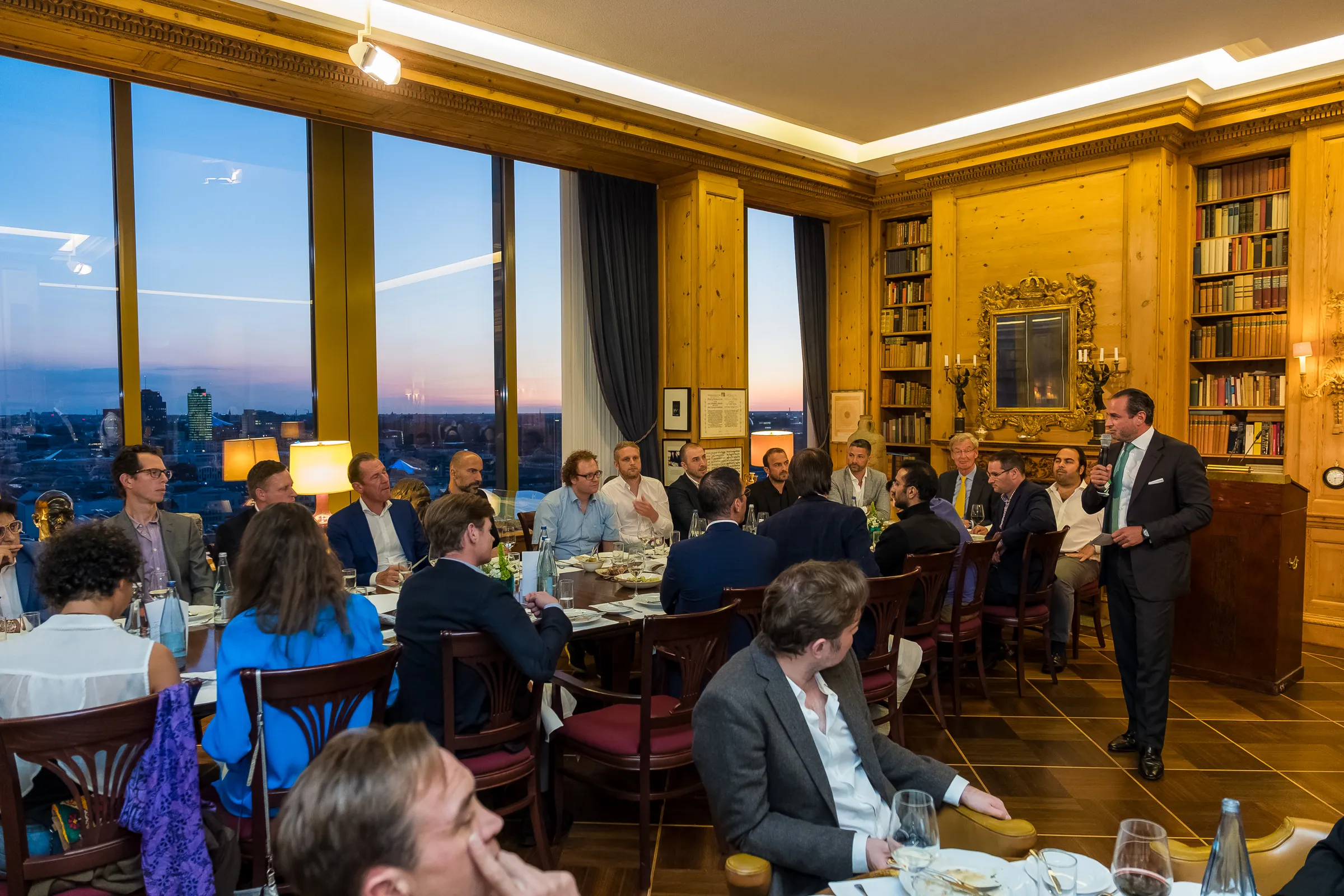 NOAH Berlin Speakers' Dinner - Wide shot of the dinner and Q&A, Berlin skyline at dusk