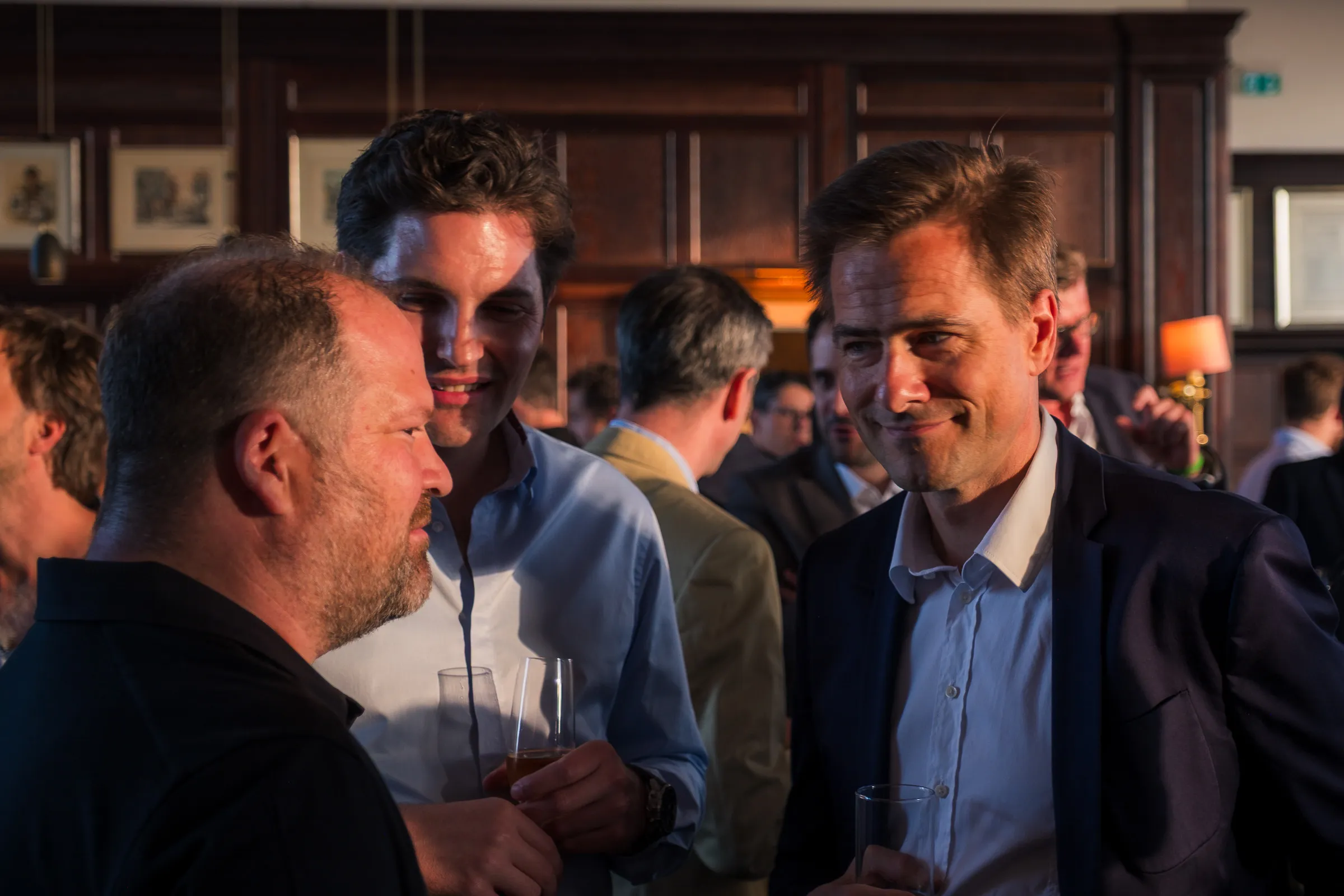 NOAH Berlin Speakers' Dinner - Candid reception conversation, golden-hour light