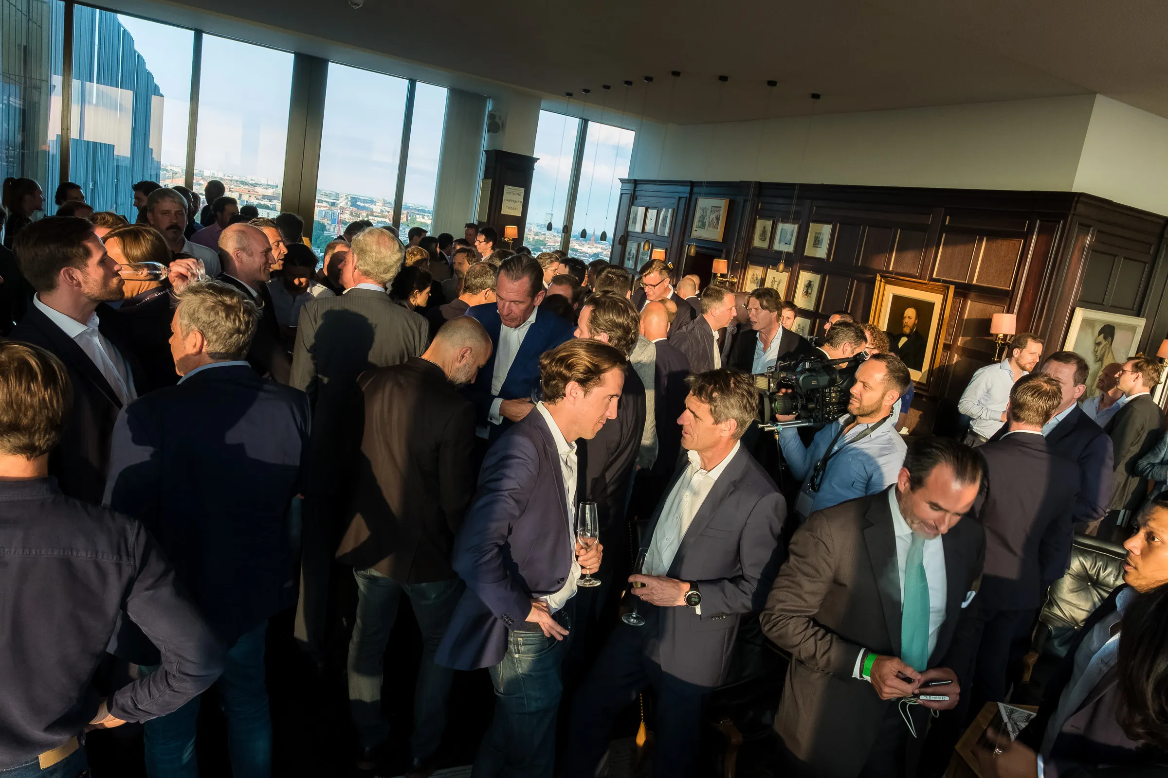NOAH Berlin Speakers' Dinner - Wide reception shot with Berlin skyline through the windows