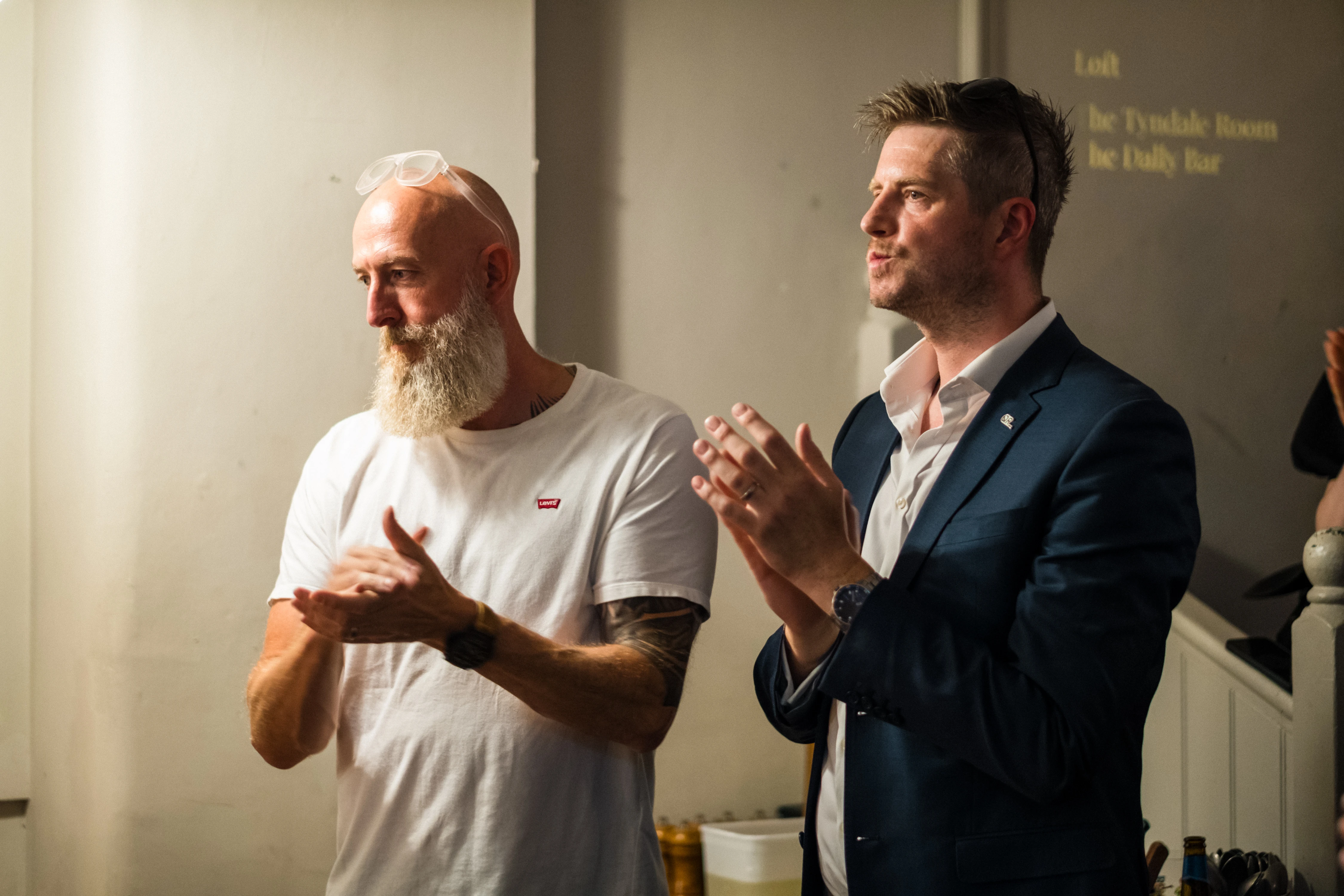Planet A Ventures Meetup London - Two attendees applauding during a moment in the evening