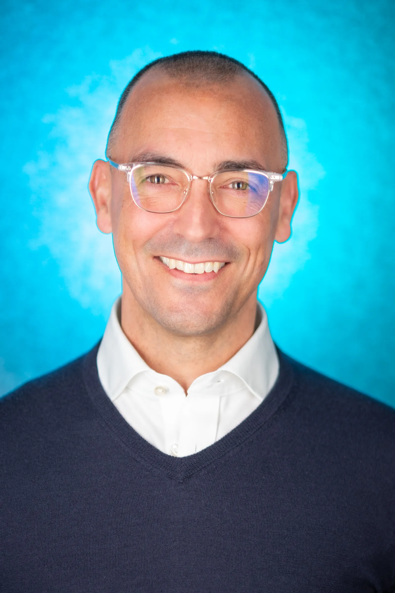 Thrasio Executive Headshots - Jim Mann, Director of Acquisitions, blue backdrop