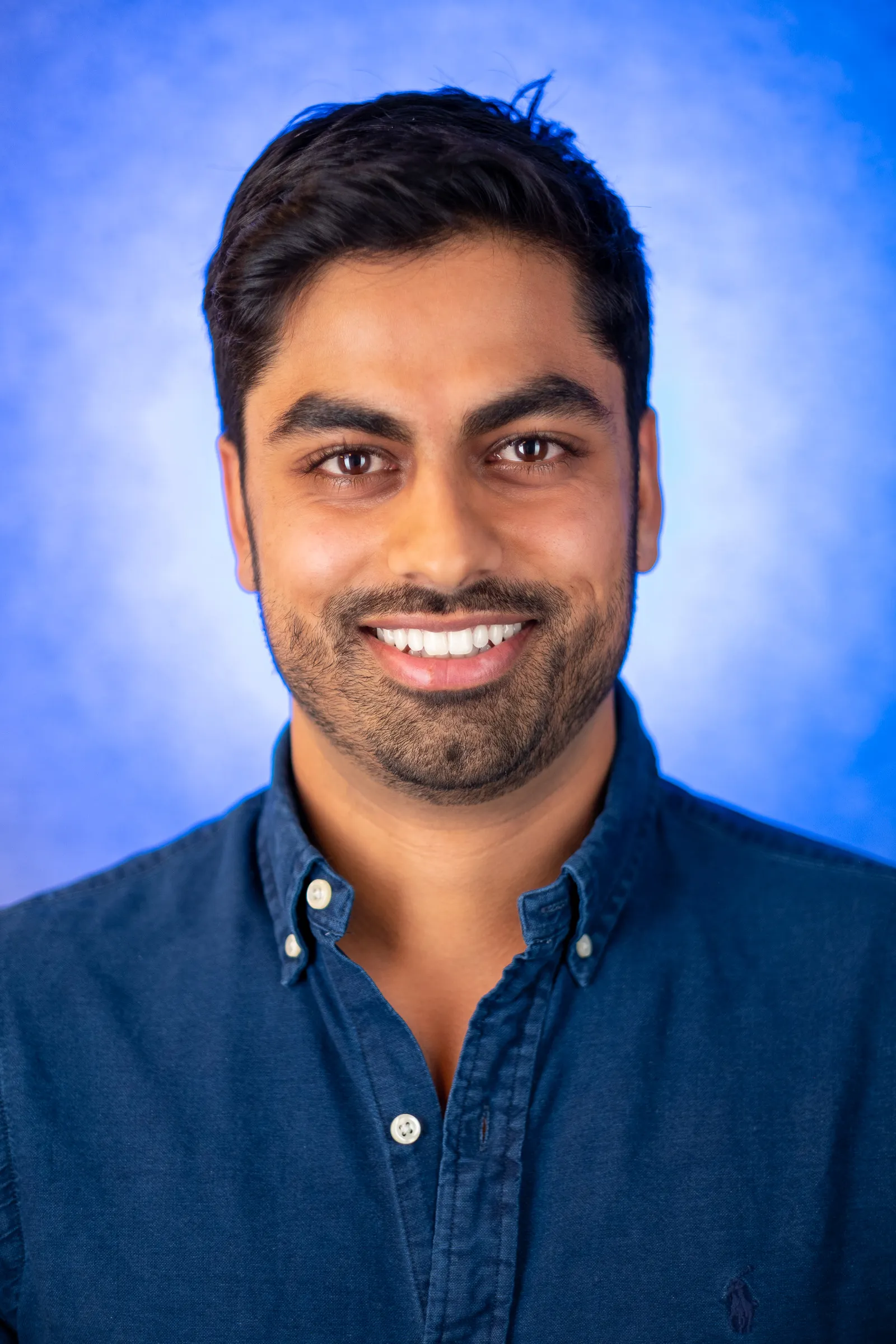 Thrasio Executive Headshots - Anup Desai, candid expression, warm backdrop