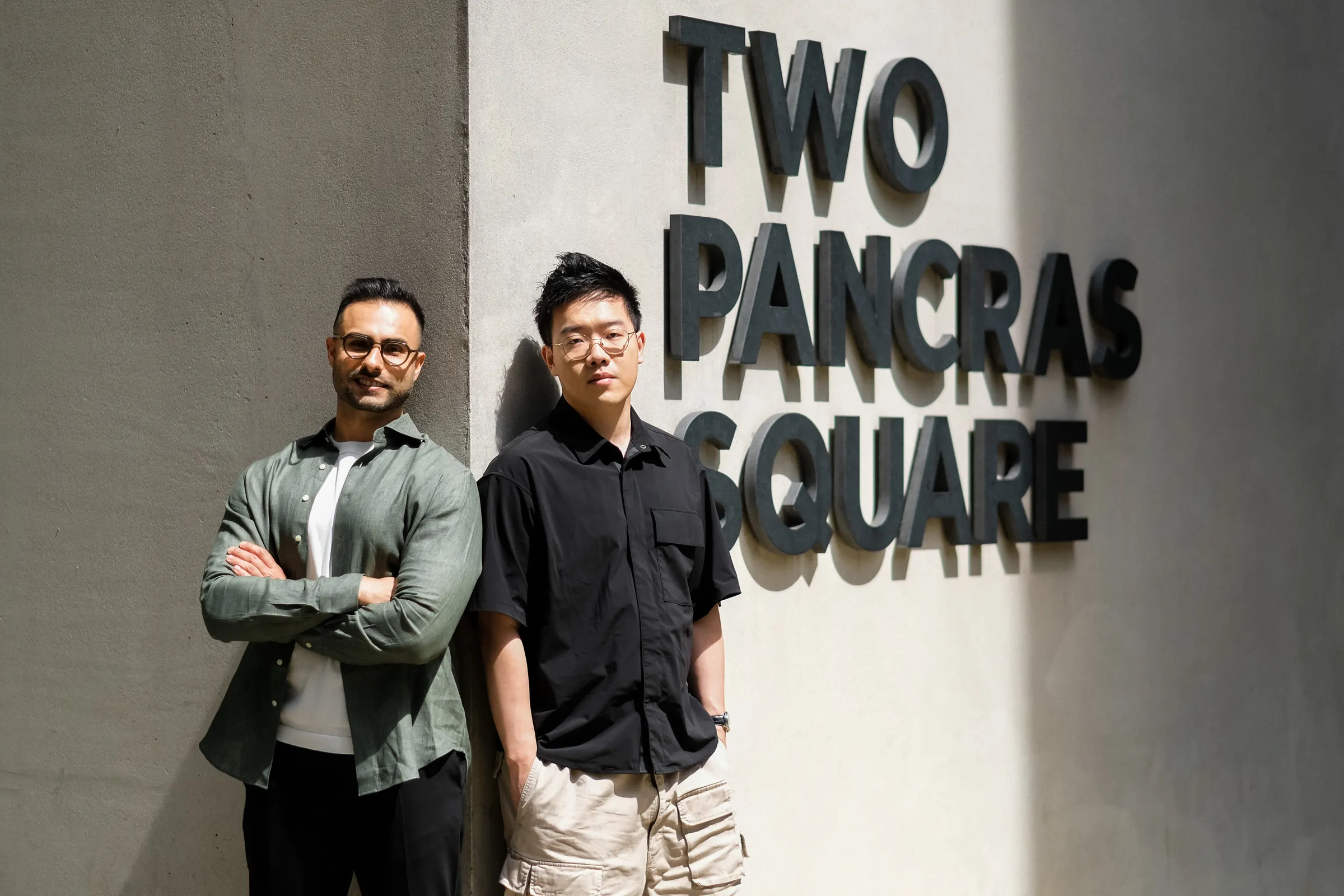 Zaro.ai Founder Portraits - Duo shot against Two Pancras Square signage