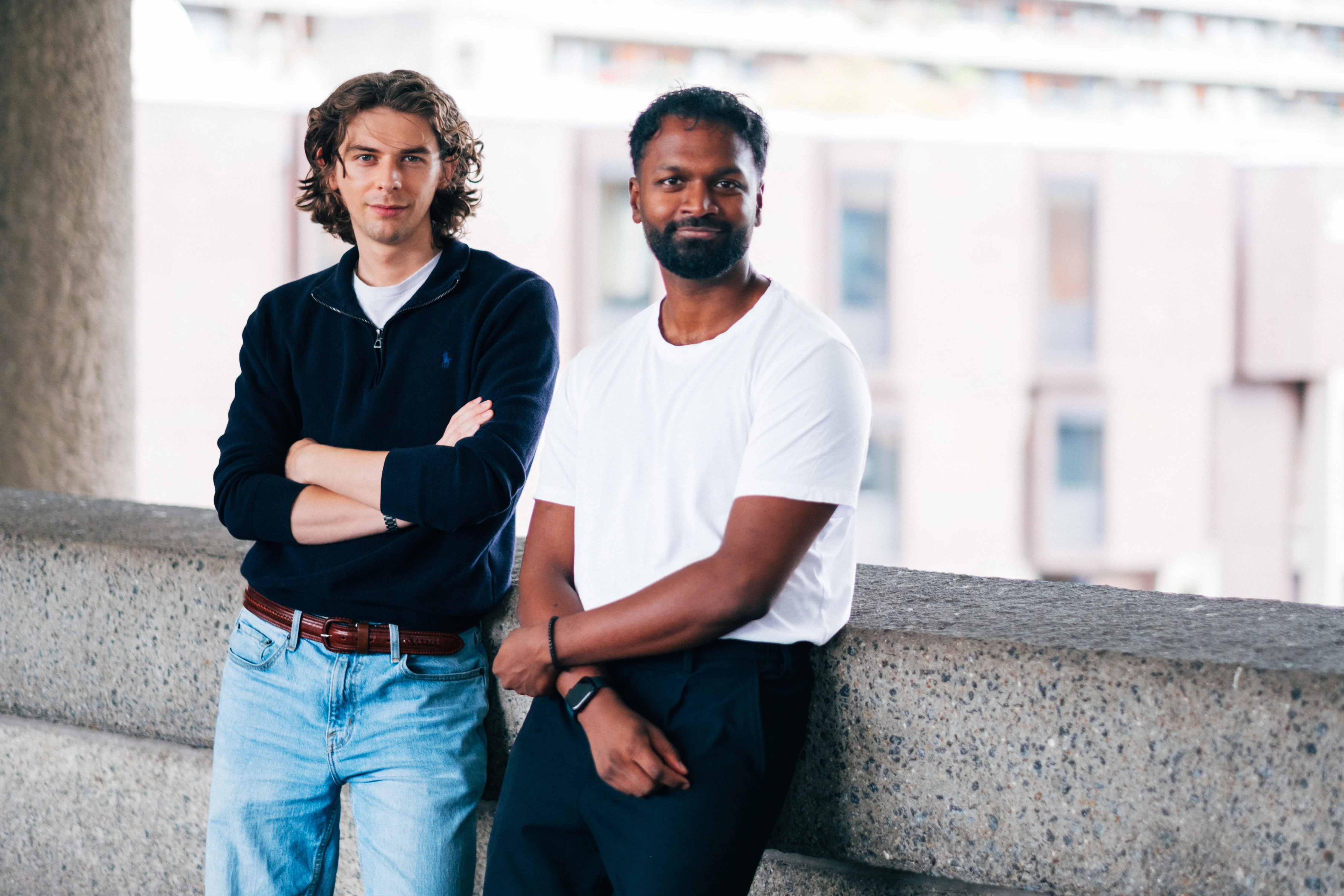 Zenithon AI Founders - Founders leaning on a Barbican wall, arms crossed, terraces behind